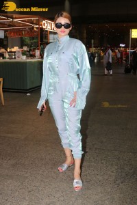 Urvashi Rautela in a blue dress at the Airport
