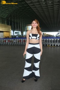 Actress Urvashi Rautela in a black and white dress