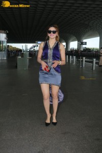 Actress Urvashi Rautela in a denim mini skirt
