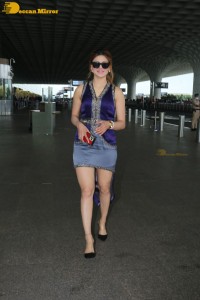 Actress Urvashi Rautela in a denim mini skirt