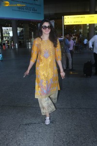 actress urvashi rautela in a shiny yellow dress