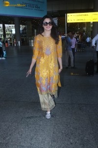 actress urvashi rautela in a shiny yellow dress