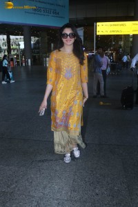 actress urvashi rautela in a shiny yellow dress