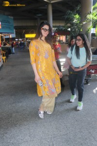 actress urvashi rautela in a shiny yellow dress