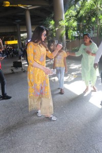 actress urvashi rautela in a shiny yellow dress