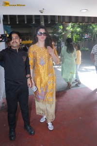 actress urvashi rautela in a shiny yellow dress