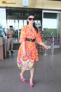 indian actress urvashi rautela in a orange dress at the airport
