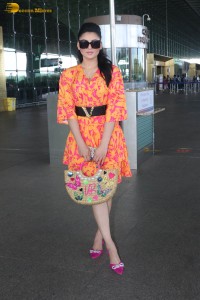 indian actress urvashi rautela in a orange dress at the airport
