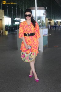 indian actress urvashi rautela in a orange dress at the airport