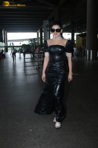 actress and model urvashi rautela stunning looks in a black dress at mumbai airport