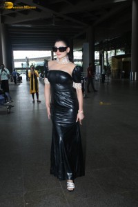 actress and model urvashi rautela stunning looks in a black dress at mumbai airport