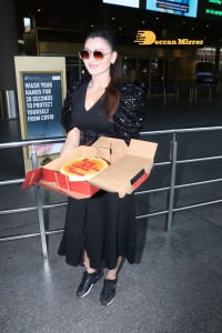 Urvashi Rautela celebrates her Birthday at Airport with Photographers