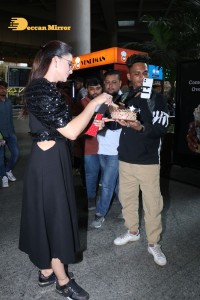 Urvashi Rautela celebrates her Birthday at Airport with Photographers