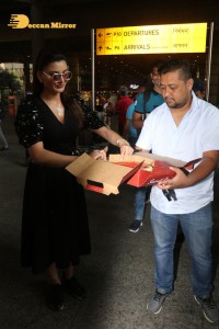 Urvashi Rautela celebrates her Birthday at Airport with Photographers