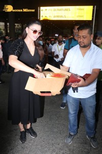 Urvashi Rautela celebrates her Birthday at Airport with Photographers
