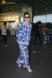 Bollywood actress Urvashi Rautela dressed in blue and white