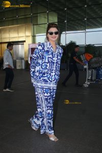 Bollywood actress Urvashi Rautela dressed in blue and white