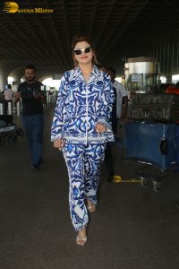 Bollywood actress Urvashi Rautela dressed in blue and white