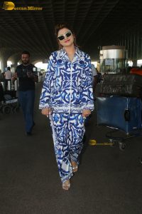 Bollywood actress Urvashi Rautela dressed in blue and white