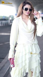 actress urvashi rautela beautiful looks in a white dress at mumbai airport