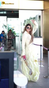actress urvashi rautela beautiful looks in a white dress at mumbai airport