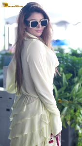actress urvashi rautela beautiful looks in a white dress at mumbai airport