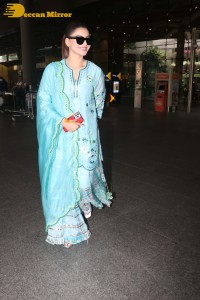 Actress Urvashi Rautela in a green salwar kameez dress at the Airport