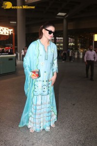 Actress Urvashi Rautela in a green salwar kameez dress at the Airport