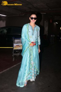Actress Urvashi Rautela in a green salwar kameez dress at the Airport