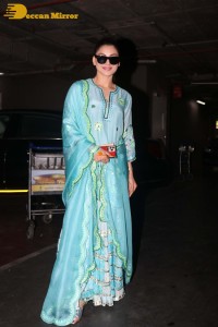 Actress Urvashi Rautela in a green salwar kameez dress at the Airport