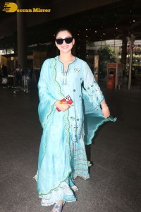 Actress Urvashi Rautela in a green salwar kameez dress at the Airport