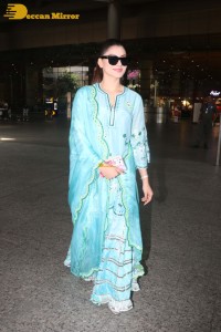 Actress Urvashi Rautela in a green salwar kameez dress at the Airport