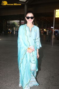 Actress Urvashi Rautela in a green salwar kameez dress at the Airport