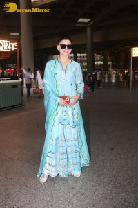 Actress Urvashi Rautela in a green salwar kameez dress at the Airport