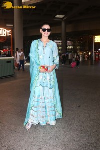 Actress Urvashi Rautela in a green salwar kameez dress at the Airport