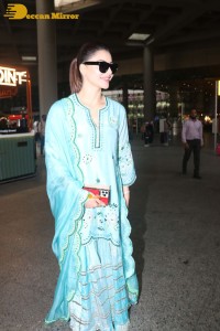 Actress Urvashi Rautela in a green salwar kameez dress at the Airport