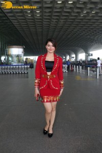 Actress Urvashi Rautela is seen at Mumbai Airport dressed in a red coat and skirt