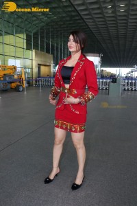 Actress Urvashi Rautela is seen at Mumbai Airport dressed in a red coat and skirt