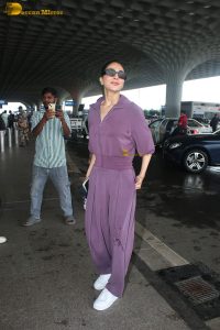 actress vaani kapoor stylish in purple dress at airport
