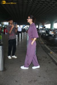 actress vaani kapoor stylish in purple dress at airport