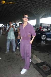 actress vaani kapoor stylish in purple dress at airport