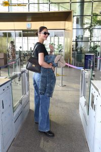 actress vaani kapoor sexy in black top and blue jeans