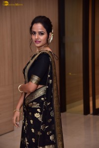 actress vaishnavi chaitanya sweet looks in a black saree