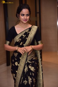 actress vaishnavi chaitanya sweet looks in a black saree