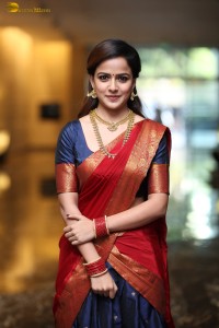 actress Vaishnavi Chaitanya pretty in a red half saree