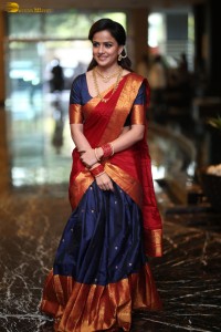 actress Vaishnavi Chaitanya pretty in a red half saree