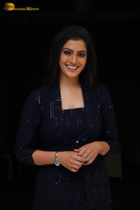 Indian Actress Varalaxmi Sarathkumar in a black dress