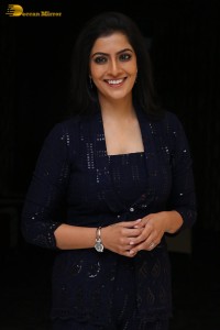 Indian Actress Varalaxmi Sarathkumar in a black dress