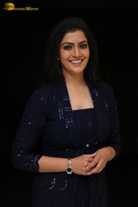 Indian Actress Varalaxmi Sarathkumar in a black dress