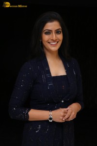 Indian Actress Varalaxmi Sarathkumar in a black dress
